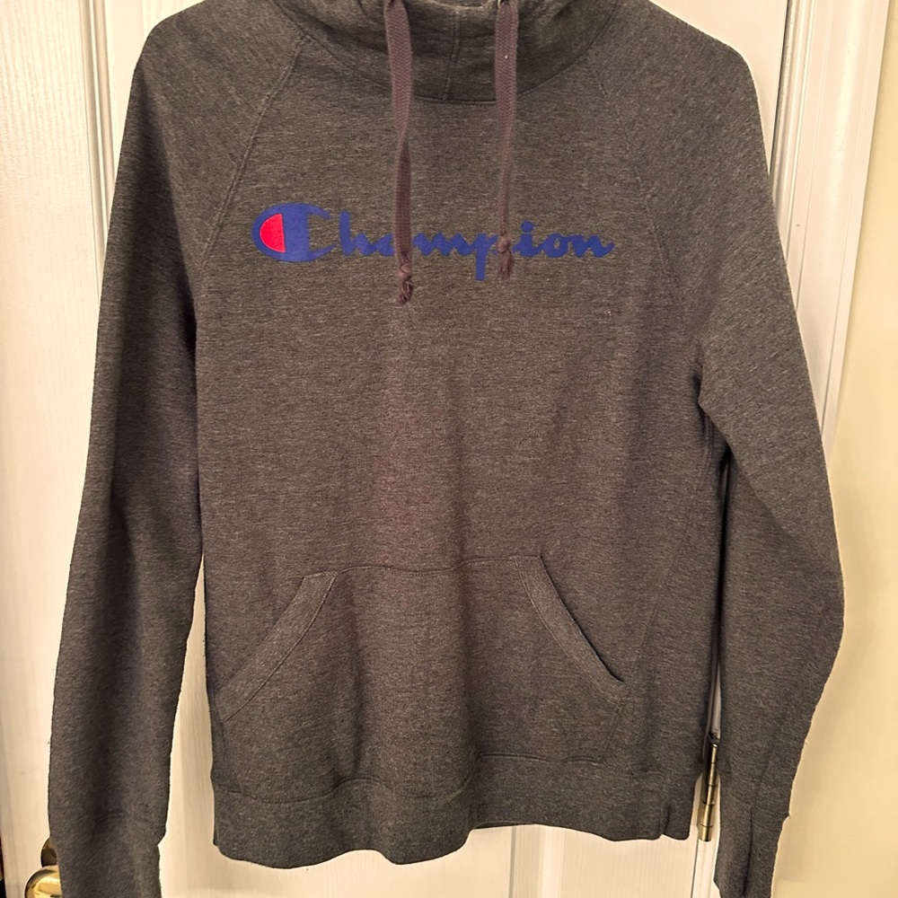 Dark gray champion hoodie, adult small. Nice relaxed fit.